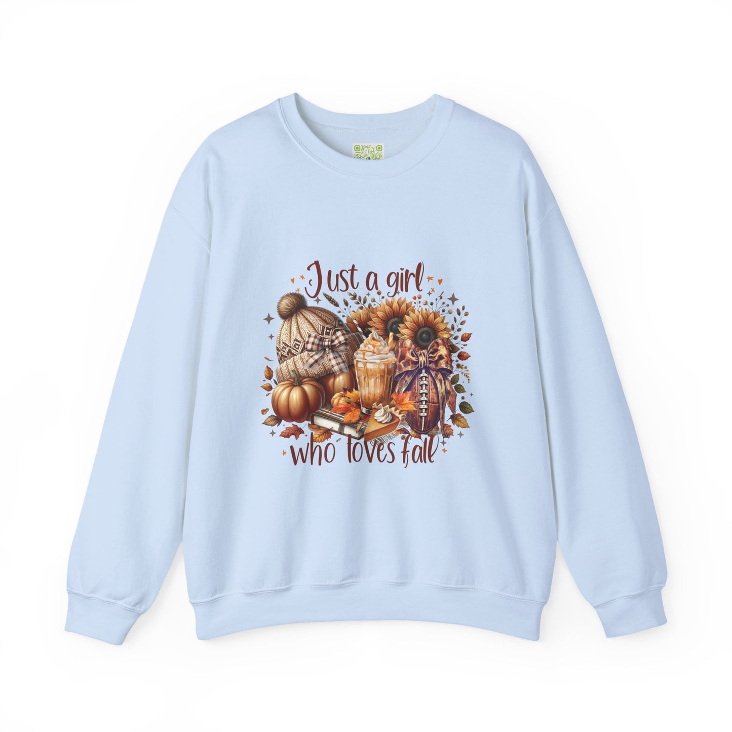 Woman wearing a cozy white sweatshirt with autumn-themed graphic saying 'Just a girl who loves fall'.