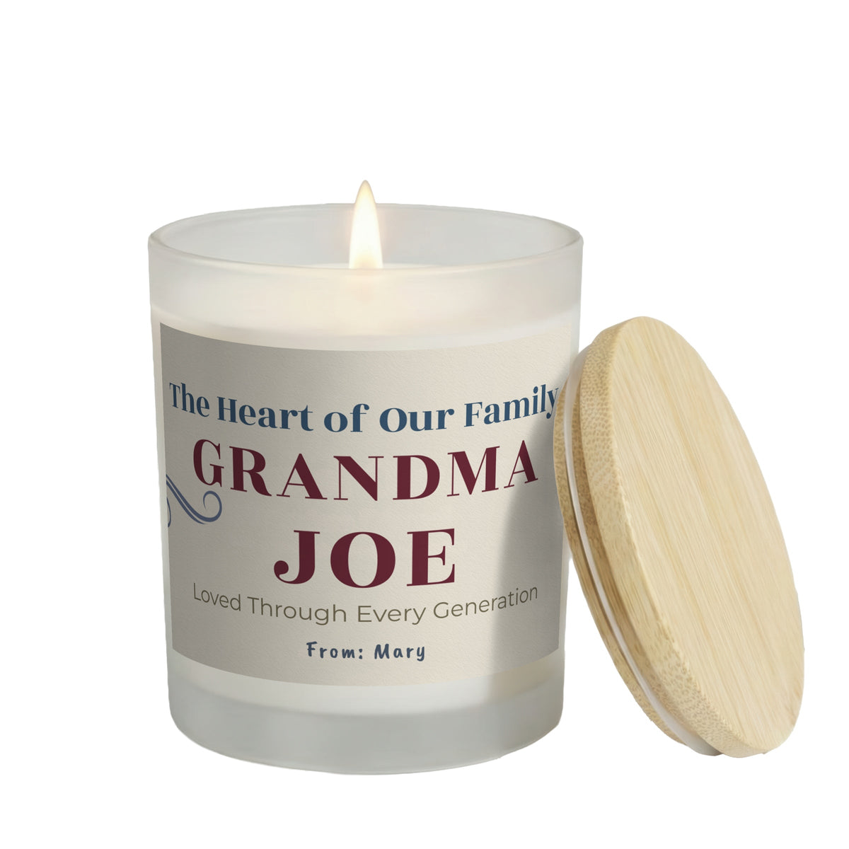 The Heart of Our Family personalized frosted candle, lit with the bamboo lid set aside, on a white background