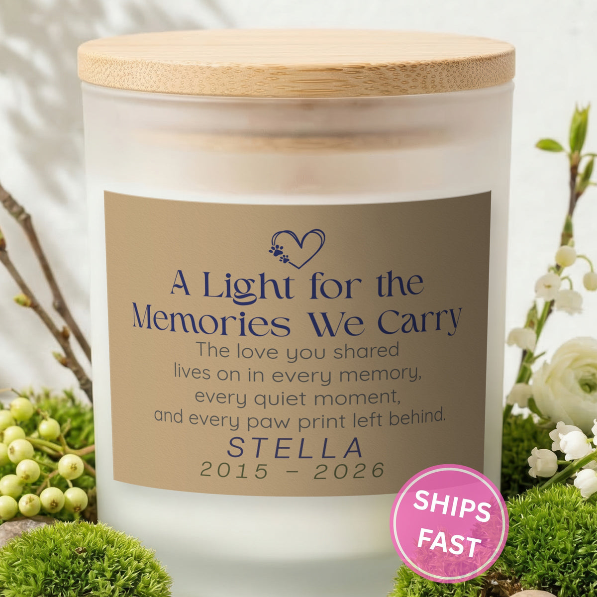 Every Paw Print Left Behind personalized frosted candle with bamboo lid in a lifestyle scene with greenery