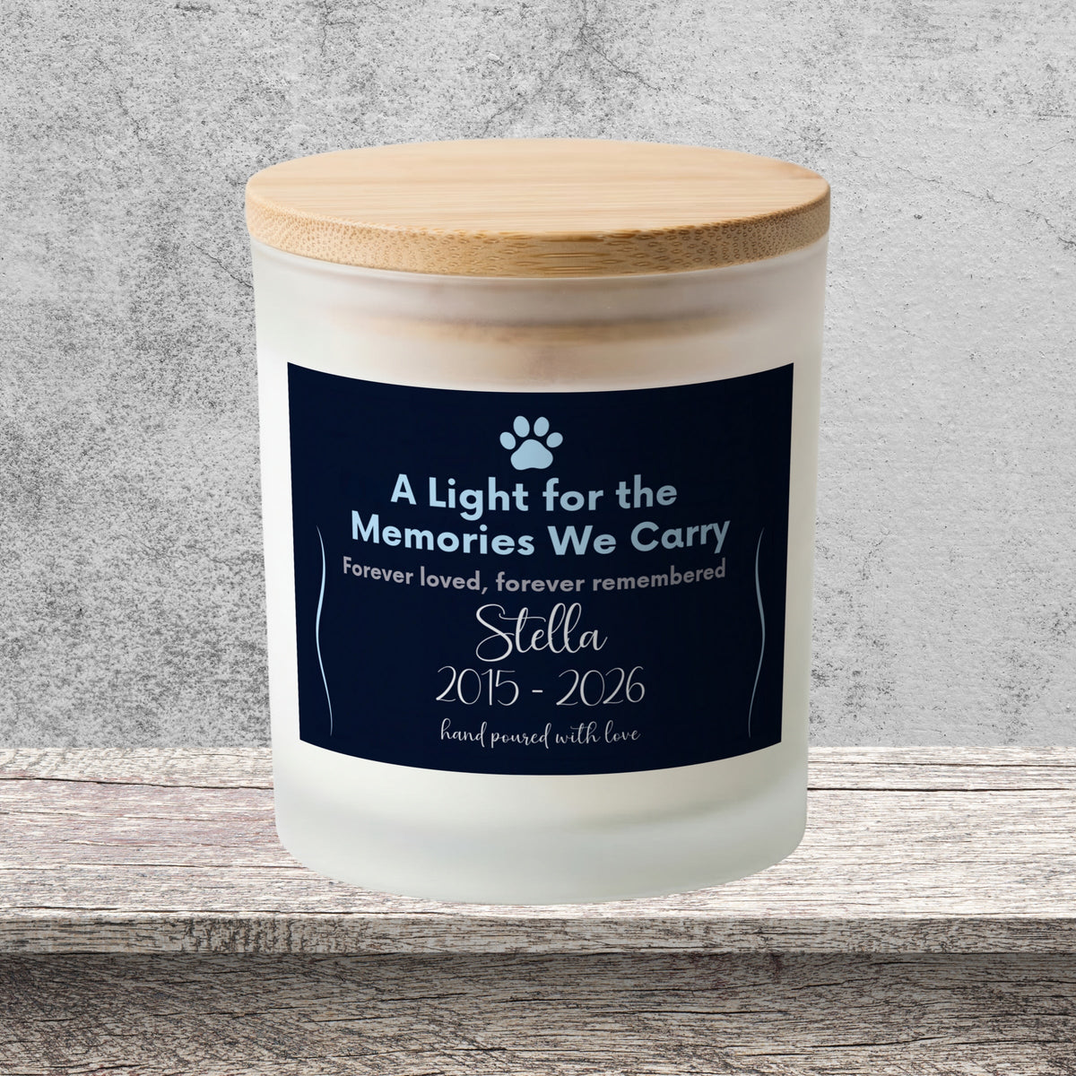 DESIGN A - A Light for the Memories We Carry personalized frosted candle on a stone backdrop