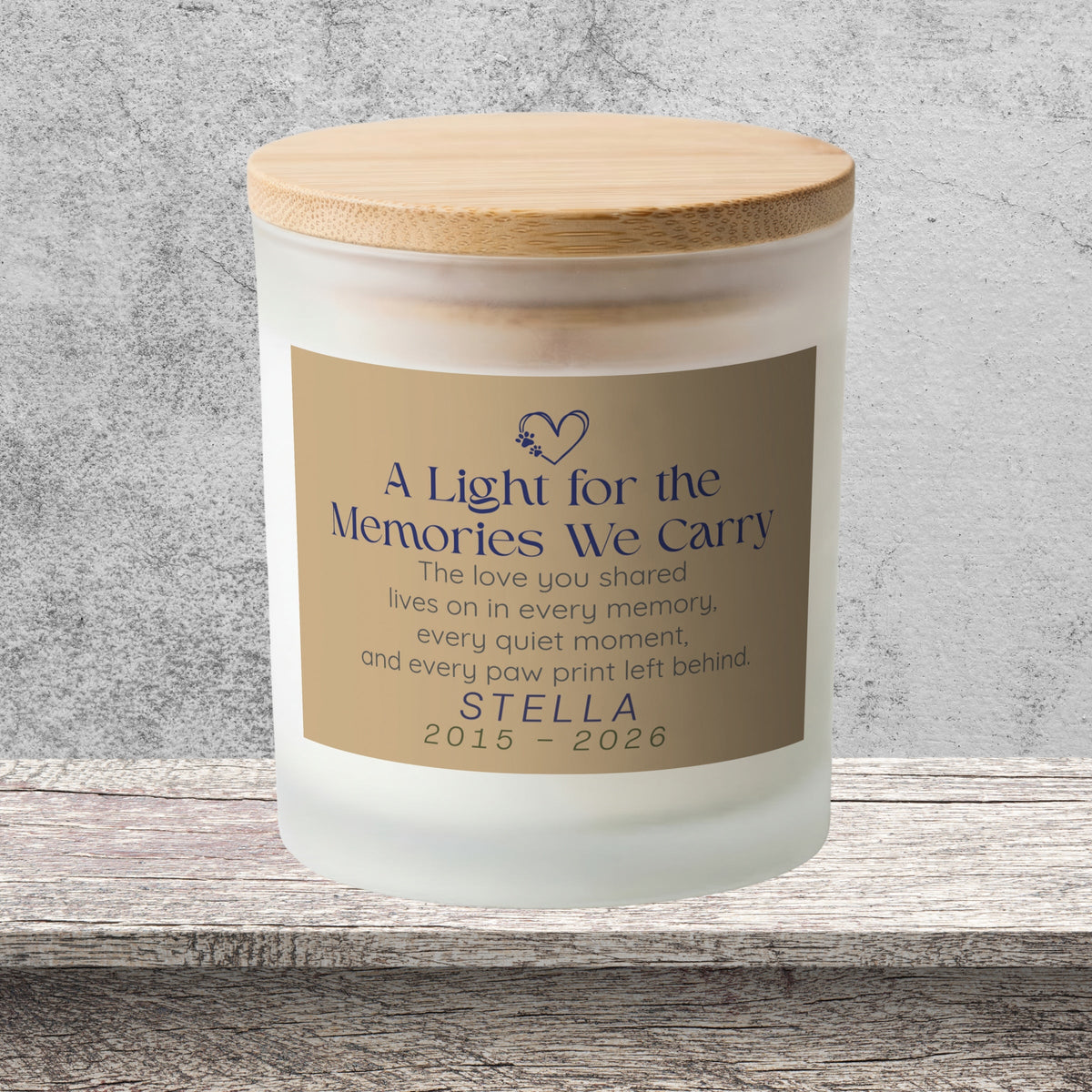 DESIGN F - Every Paw Print Left Behind personalized frosted candle on a stone backdrop