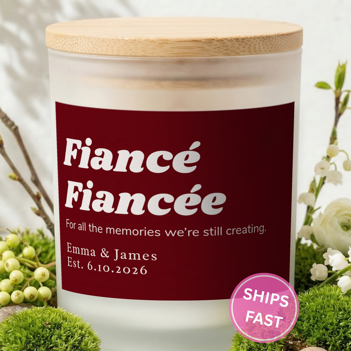 All the Memories We're Still Creating personalized frosted candle with bamboo lid in a lifestyle scene with greenery