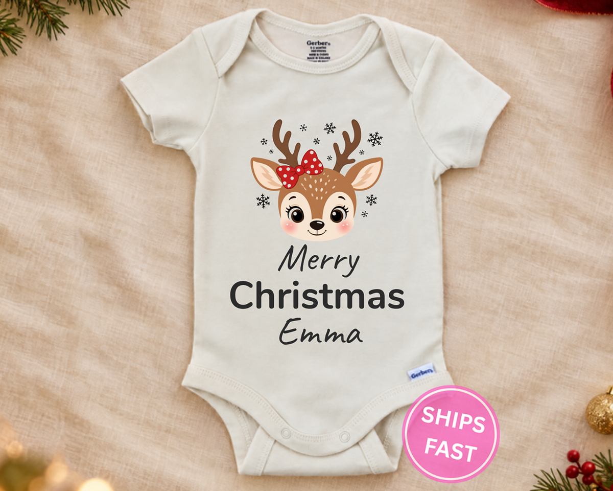 Merry Christmas reindeer personalized baby bodysuit laid flat on a soft blanket