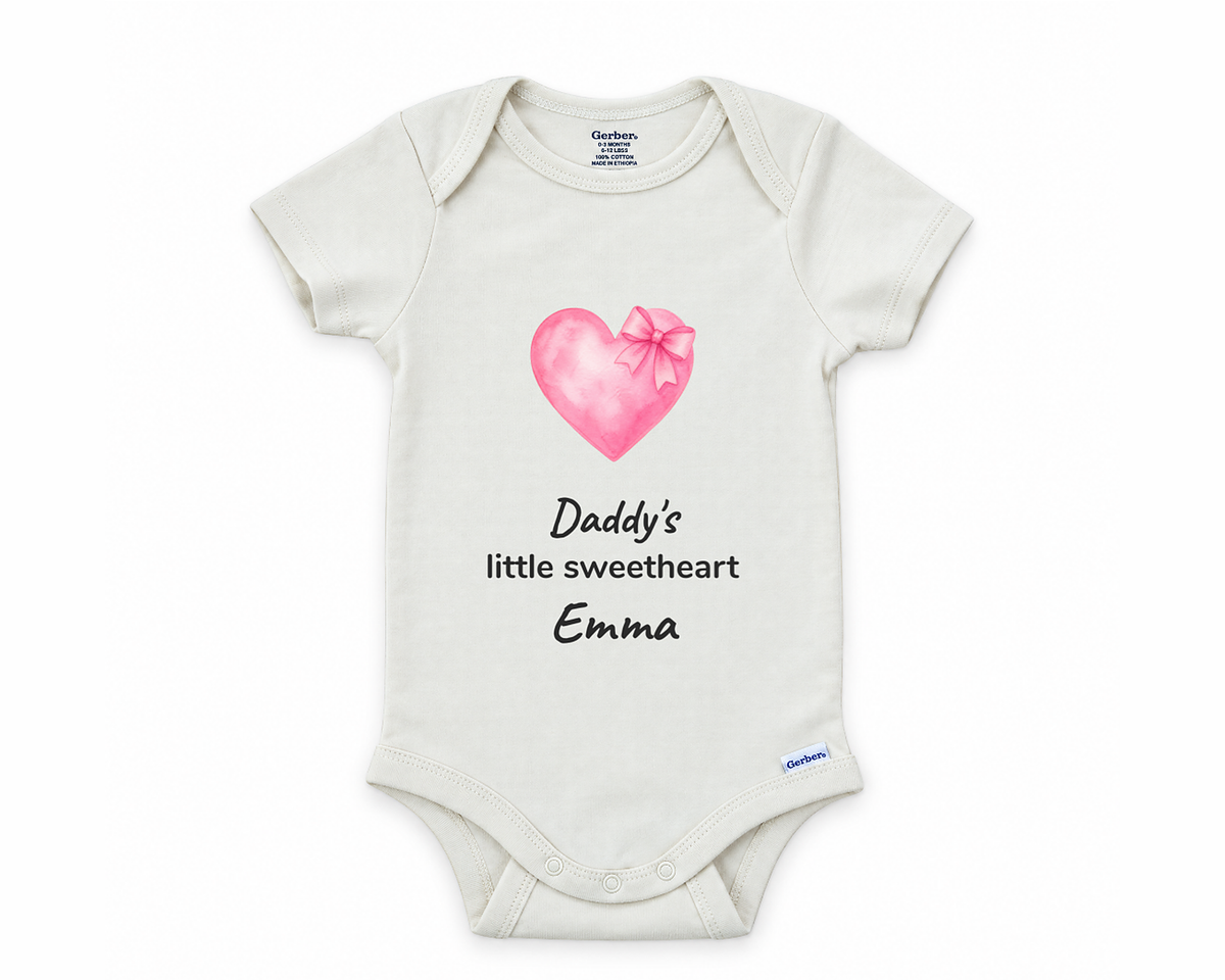 Daddy's Little Sweetheart personalized baby bodysuit with pink watercolor heart and bow on a white background