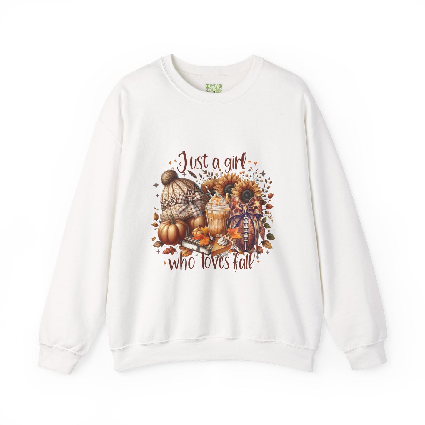 Woman wearing a cozy white sweatshirt with autumn-themed graphic saying 'Just a girl who loves fall'.