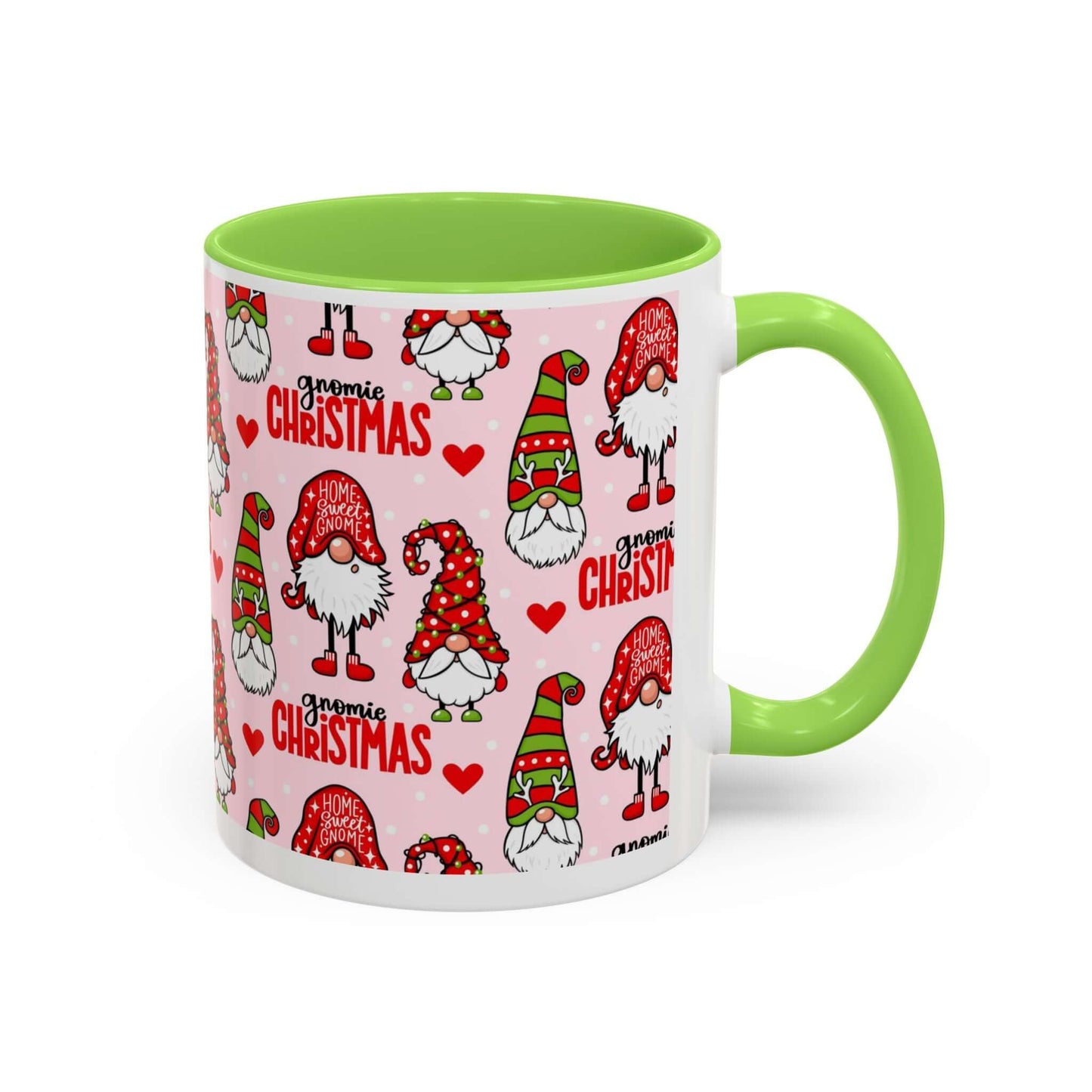 Festive Christmas gnome coffee mug with pink background and green handle featuring cheerful gnomes and holiday designs.