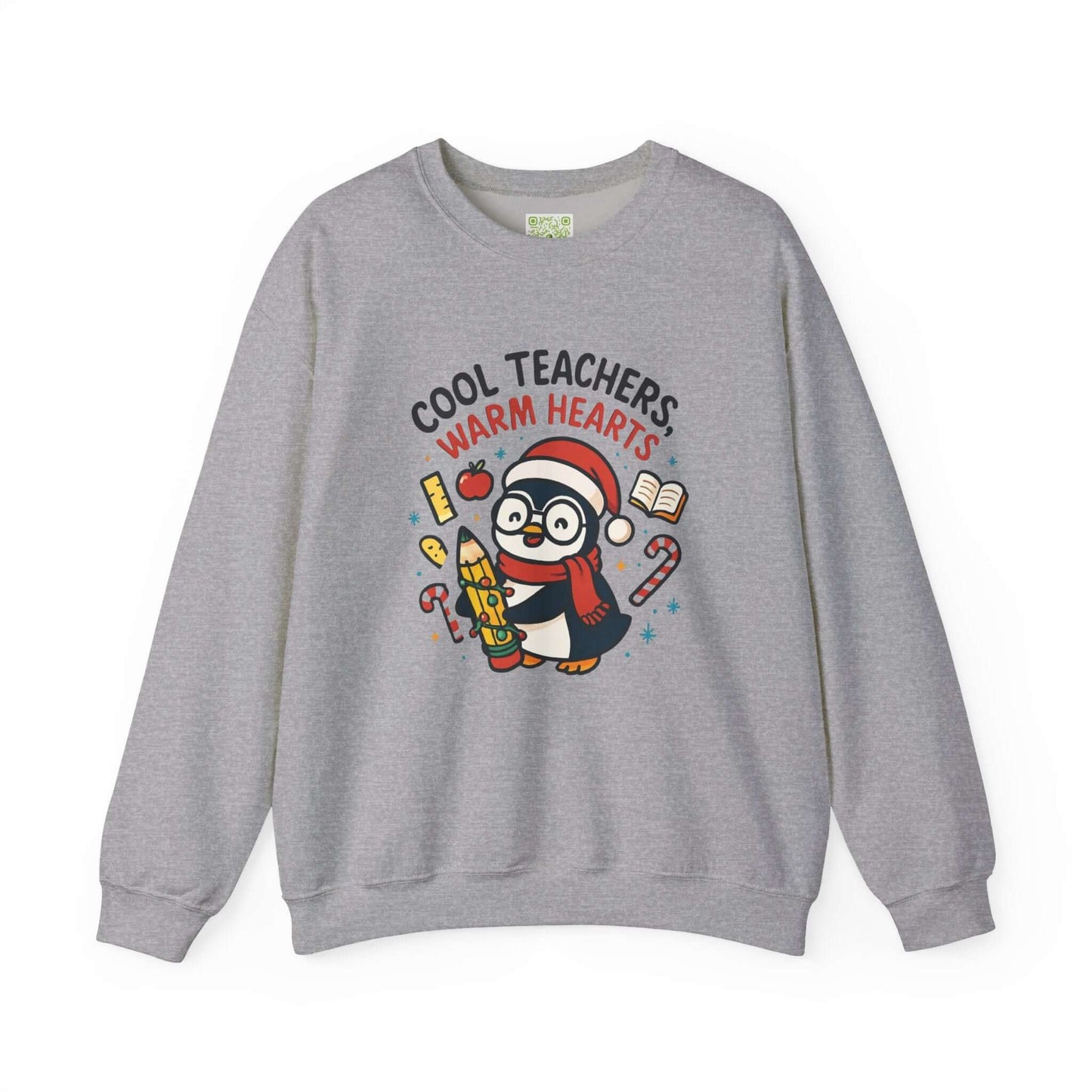 White sweatshirt featuring a cute penguin graphic with the text 'Cool Teachers Warm Hearts', perfect for teacher holiday gifts.