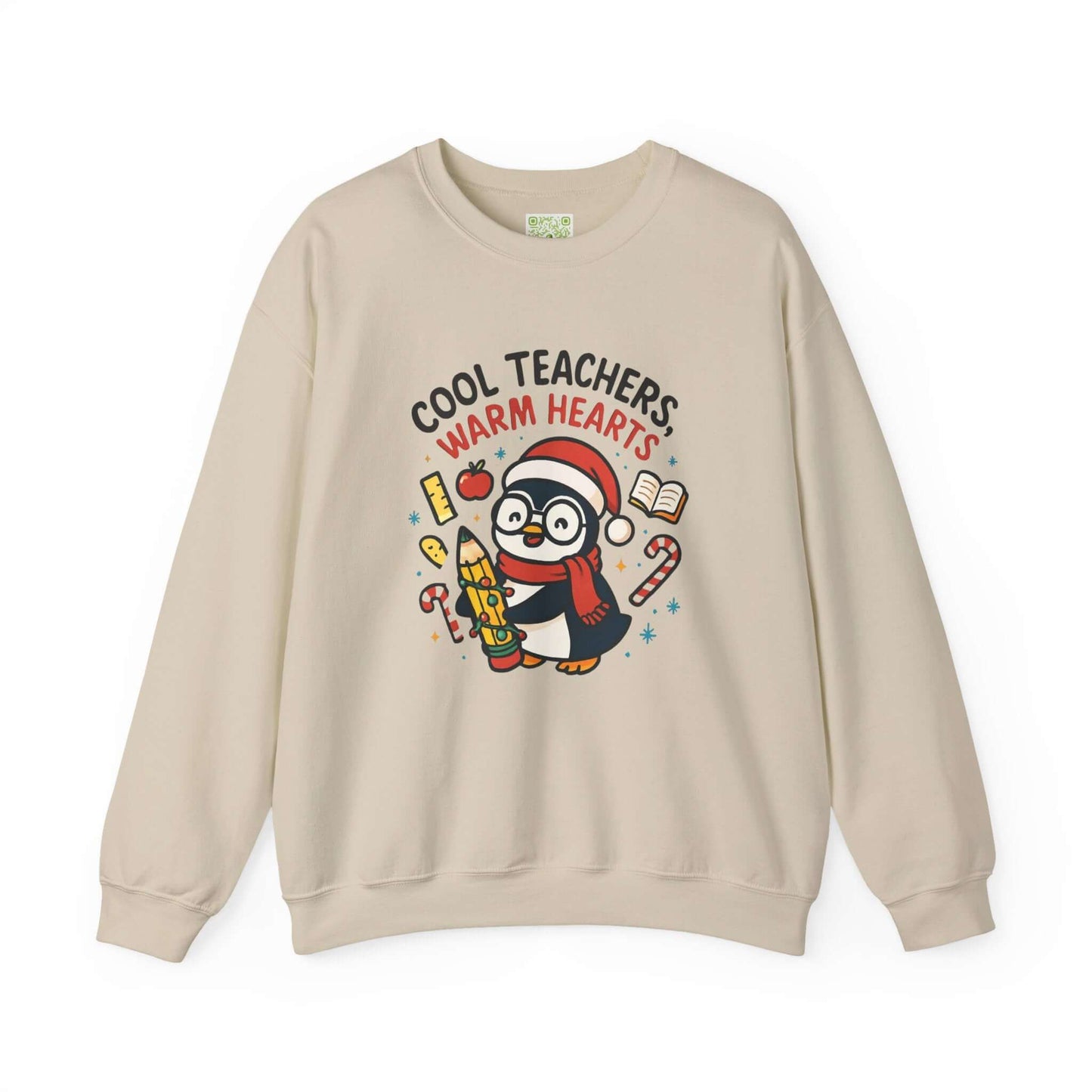 White sweatshirt featuring a cute penguin graphic with the text 'Cool Teachers Warm Hearts', perfect for teacher holiday gifts.