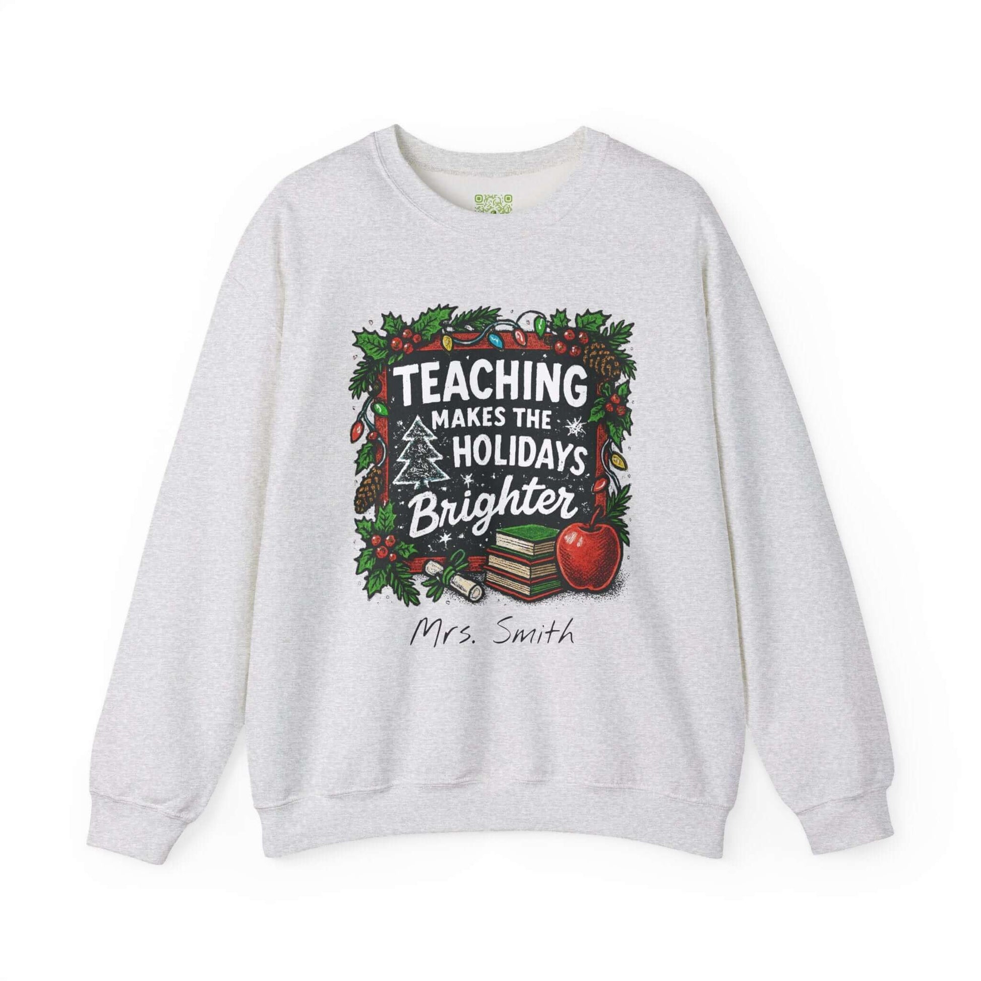 Personalized gray holiday sweatshirt with 'Teaching Makes the Holidays Brighter' design and custom name option.