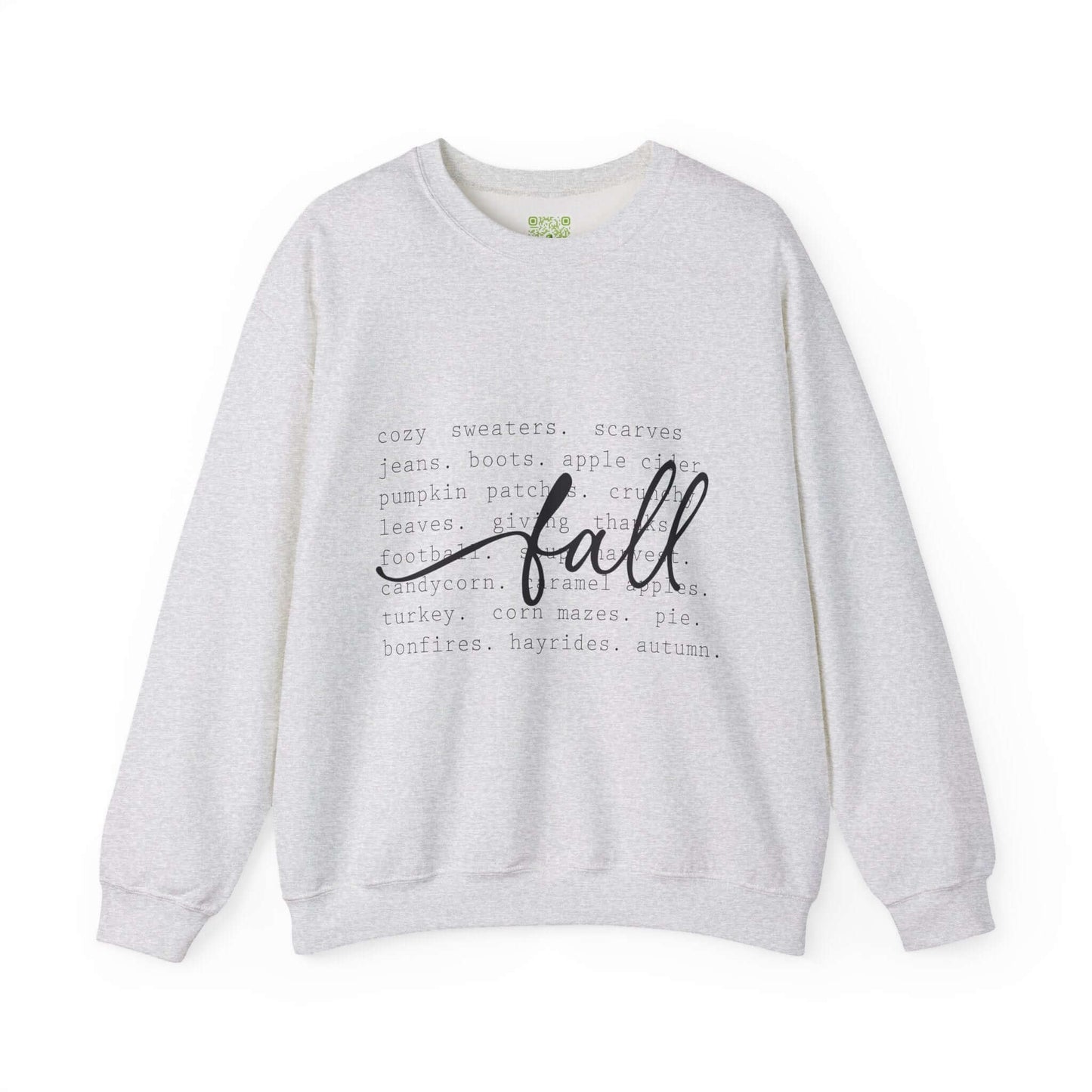 Cozy fall sweatshirt featuring autumn-themed text and words like 'fall', 'pumpkin patches', and 'bonfires' on a light gray background.