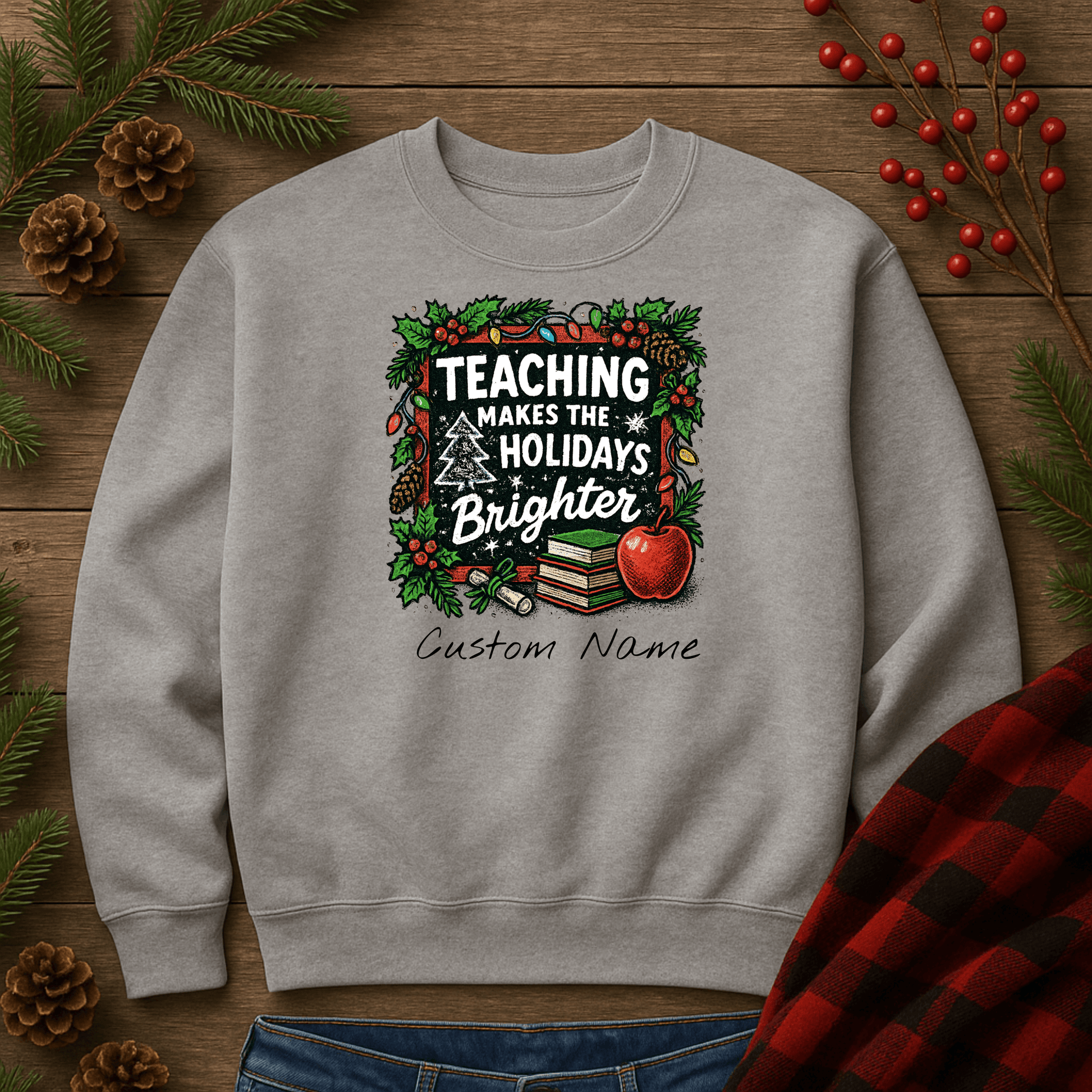 Personalized gray holiday sweatshirt with 'Teaching Makes the Holidays Brighter' design and custom name option.