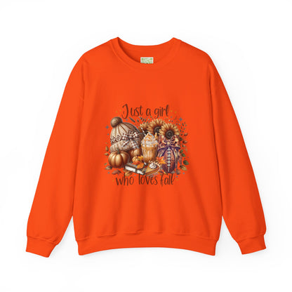 Woman wearing a cozy white sweatshirt with autumn-themed graphic saying 'Just a girl who loves fall'.