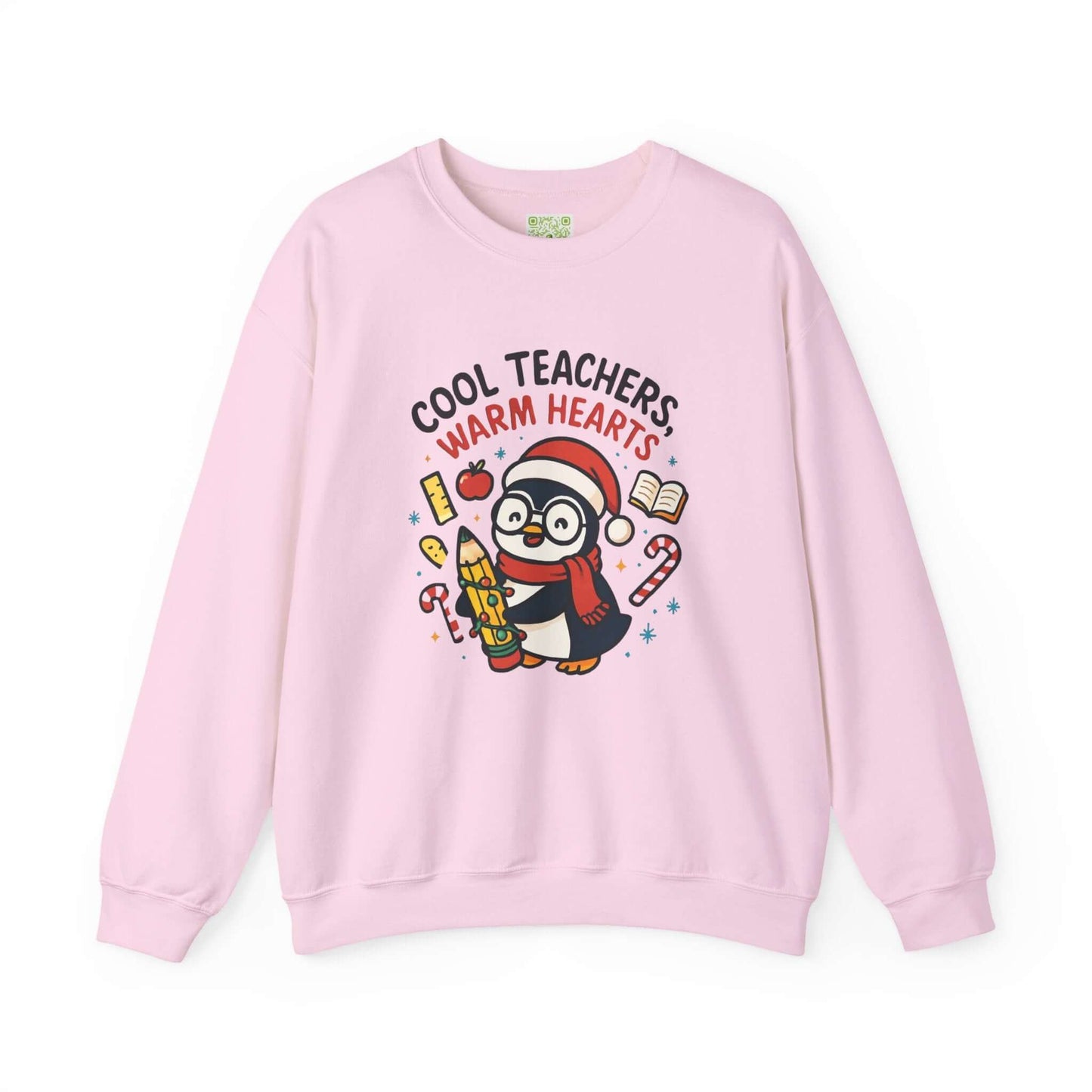 White sweatshirt featuring a cute penguin graphic with the text 'Cool Teachers Warm Hearts', perfect for teacher holiday gifts.