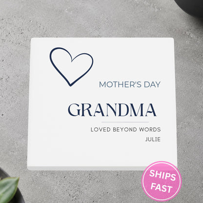 Loved Beyond Words Heart personalized ceramic coaster on a gray stone surface