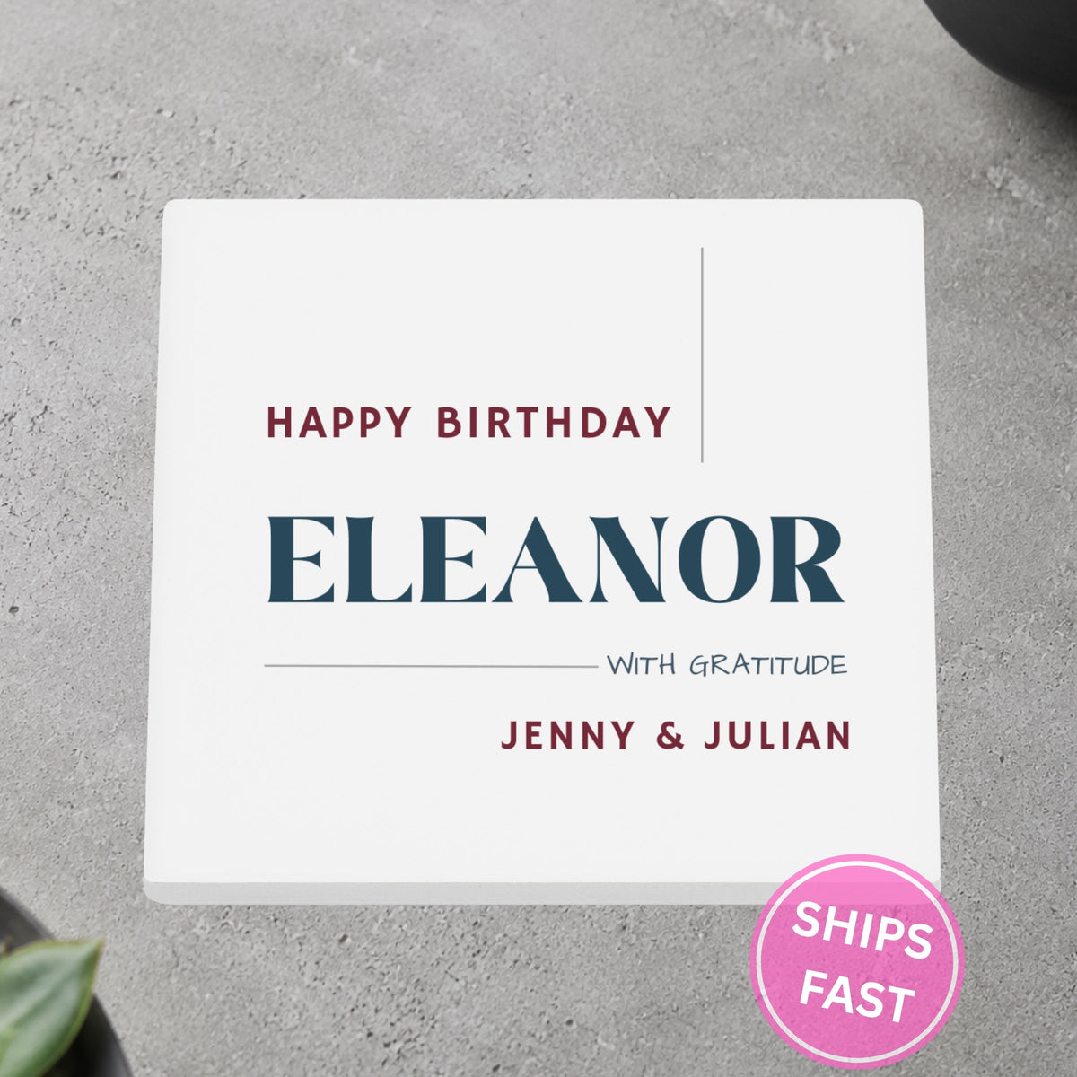 Happy Birthday With Gratitude personalized ceramic coaster on a gray stone surface