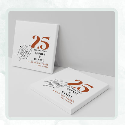 DESIGN C - Holding Hands Still Going Strong personalized ceramic coaster, two coasters shown standing and lying flat