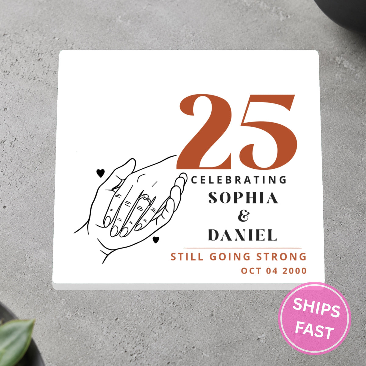 Holding Hands Still Going Strong personalized ceramic coaster on a gray stone surface