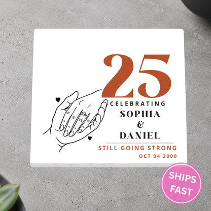 Holding Hands Still Going Strong personalized ceramic coaster on a gray stone surface