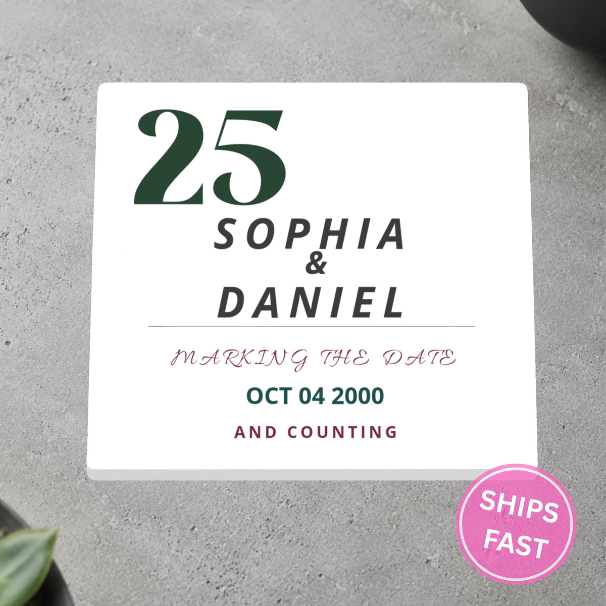 Marking the Date and Counting personalized ceramic coaster on a gray stone surface