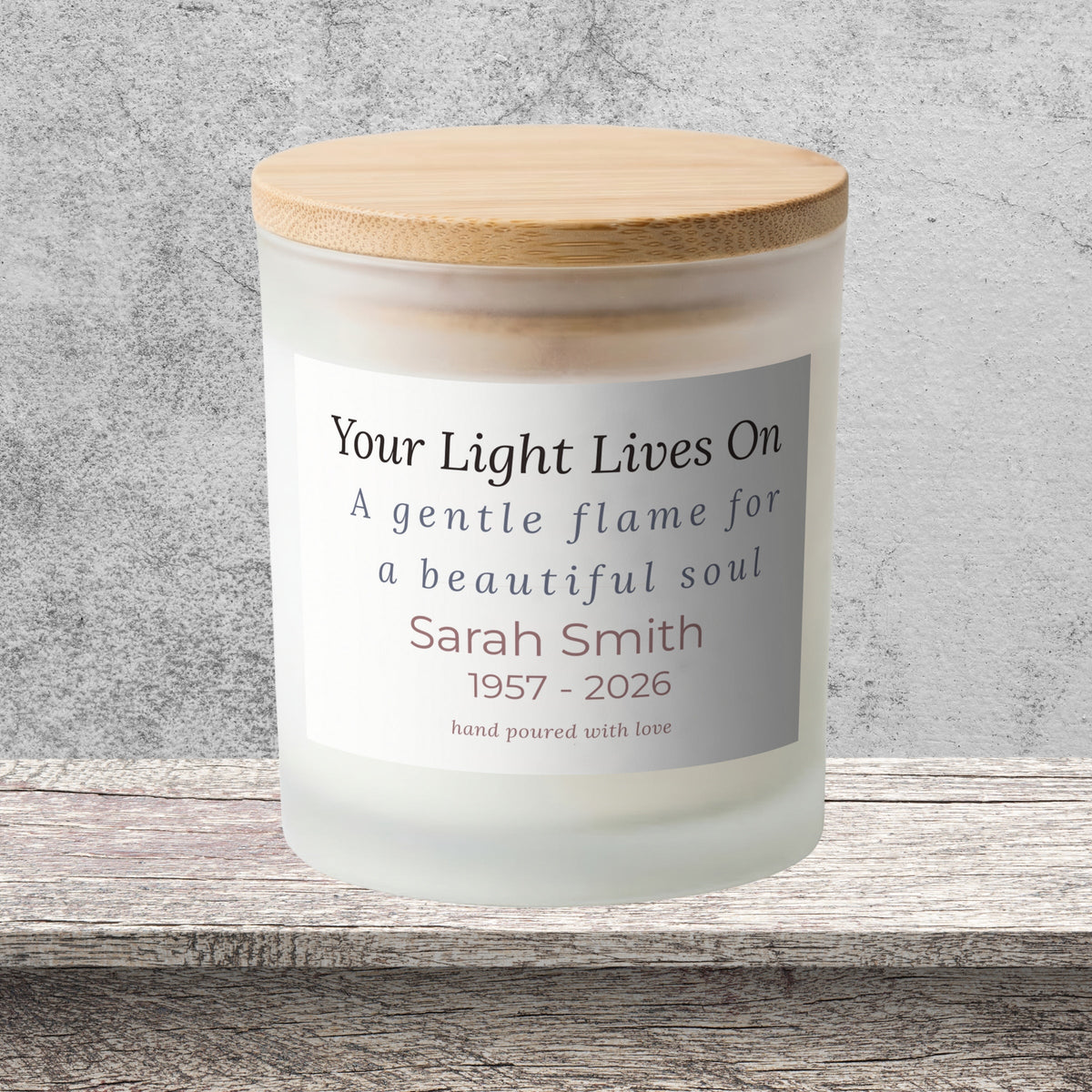 DESIGN C - Your Light Lives On personalized frosted candle on a stone backdrop