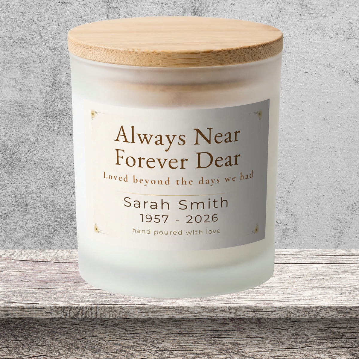 DESIGN E - Always Near, Forever Dear personalized frosted candle on a stone backdrop