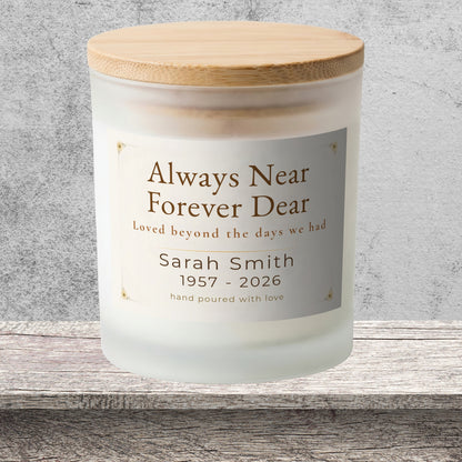 DESIGN E - Always Near, Forever Dear personalized frosted candle on a stone backdrop