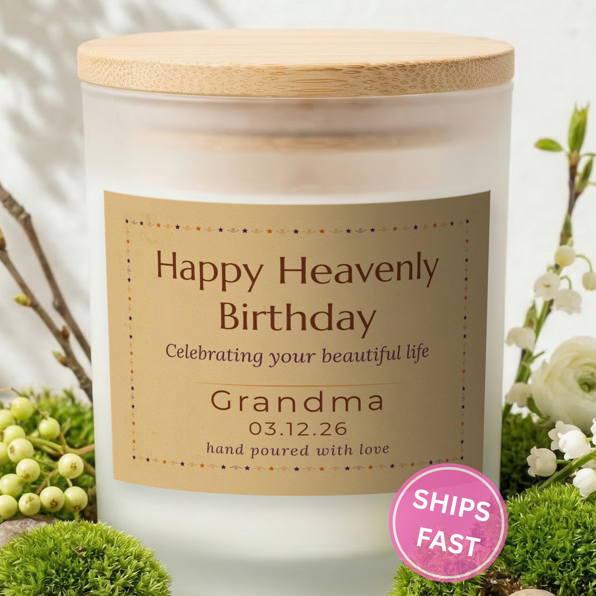 Happy Heavenly Birthday personalized frosted candle with bamboo lid in a lifestyle scene with greenery