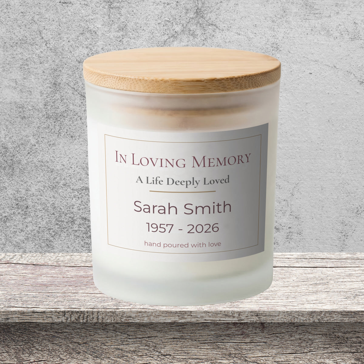 DESIGN A - In Loving Memory personalized frosted candle on a stone backdrop
