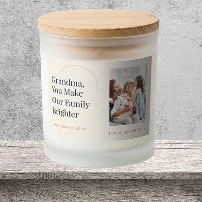 DESIGN E - You Make Our Family Brighter personalized frosted candle on a stone backdrop