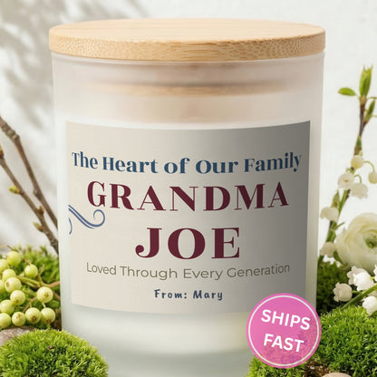 The Heart of Our Family personalized frosted candle with bamboo lid in a lifestyle scene with greenery