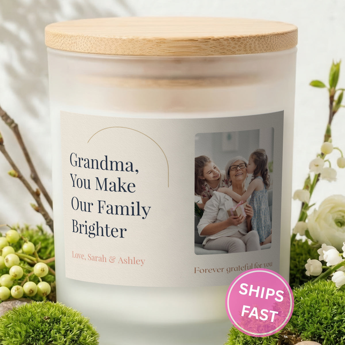 You Make Our Family Brighter personalized frosted candle with bamboo lid in a lifestyle scene with greenery