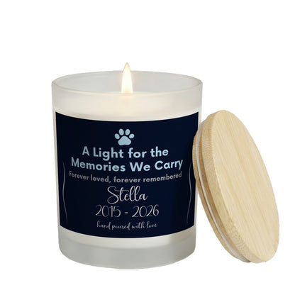 A Light for the Memories We Carry personalized frosted candle, lit with the bamboo lid set aside, on a white background