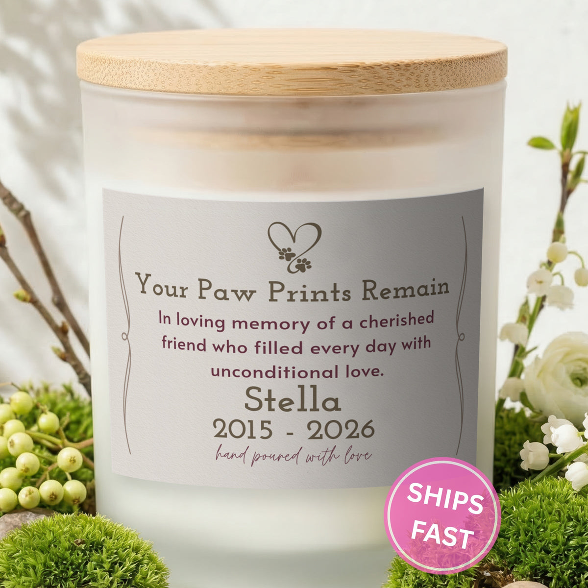 Your Paw Prints Remain personalized frosted candle with bamboo lid in a lifestyle scene with greenery