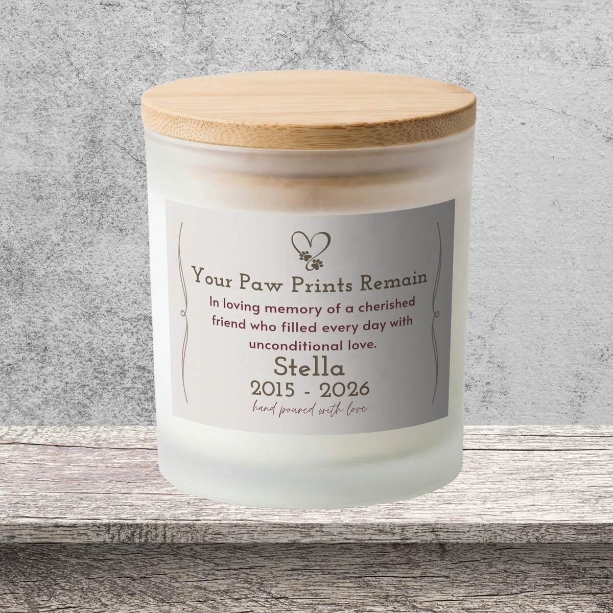 DESIGN C - Your Paw Prints Remain personalized frosted candle on a stone backdrop