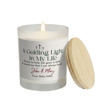 A Guiding Light in My Life personalized frosted candle, lit with the bamboo lid set aside, on a white background