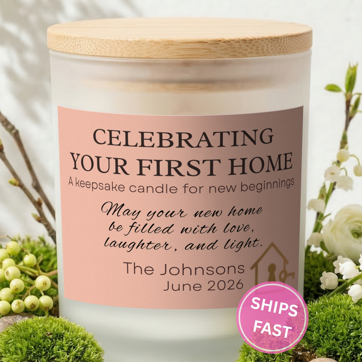 Celebrating Your First Home personalized frosted candle with bamboo lid in a lifestyle scene with greenery