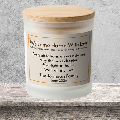 DESIGN E - Welcome Home With Love personalized frosted candle on a stone backdrop