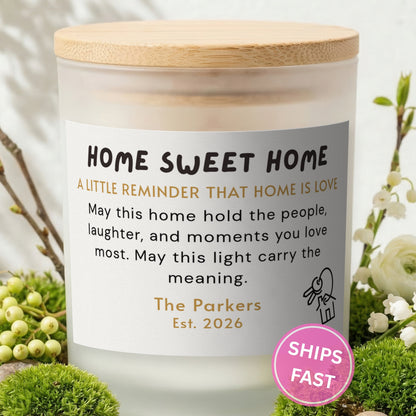 Home Is Love personalized frosted candle with bamboo lid in a lifestyle scene with greenery