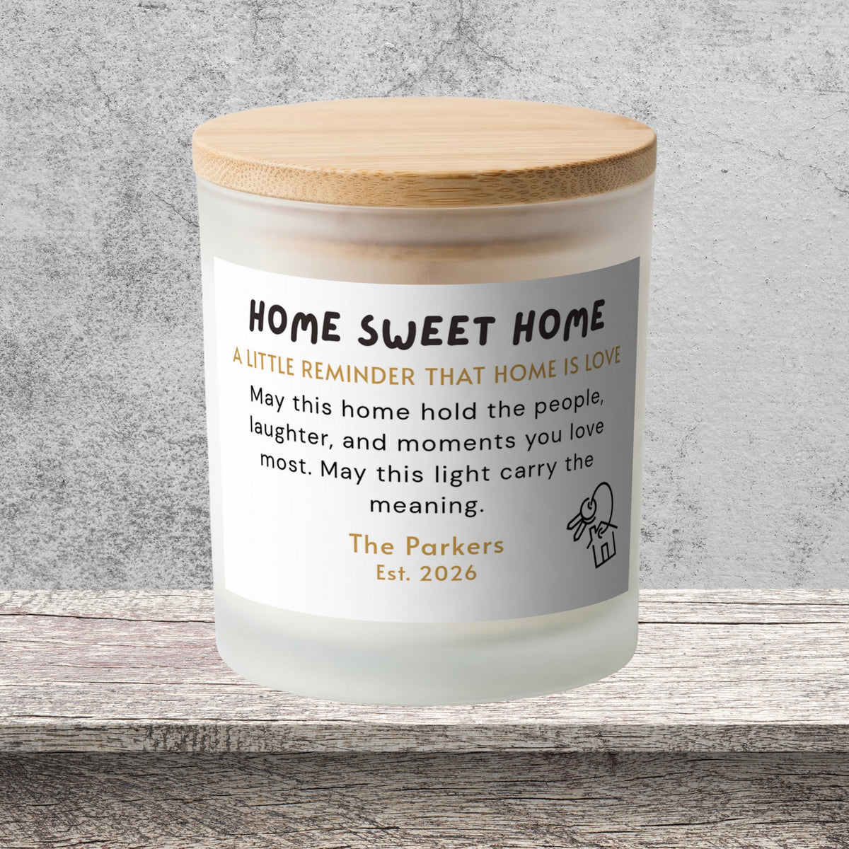 DESIGN D - Home Is Love personalized frosted candle on a stone backdrop