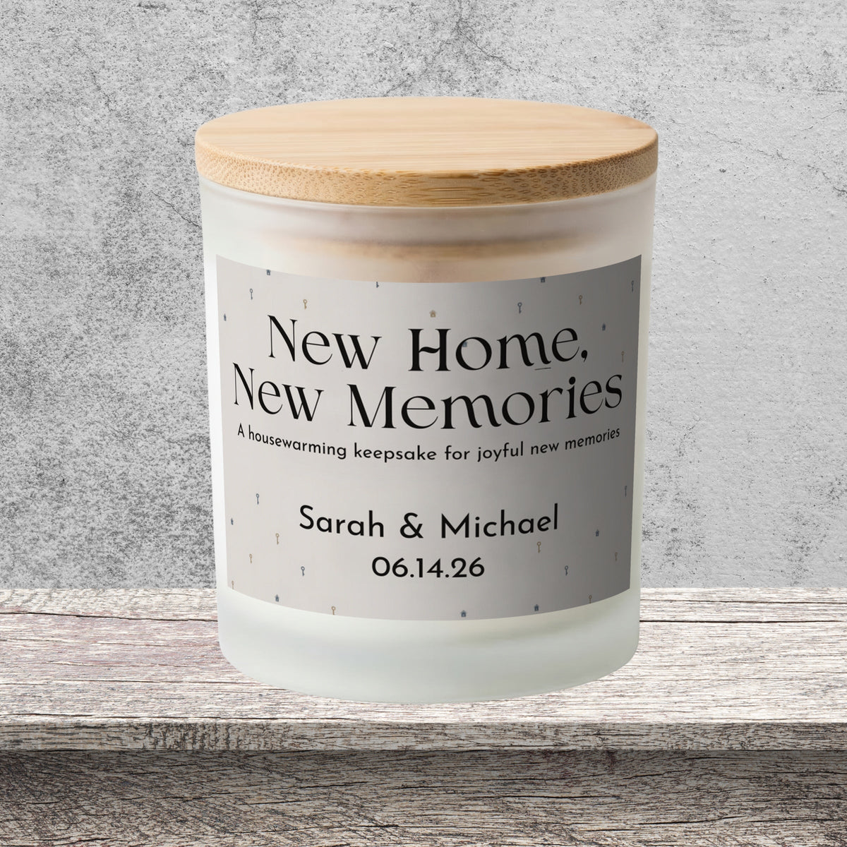 DESIGN C - New Home, New Memories personalized frosted candle on a stone backdrop