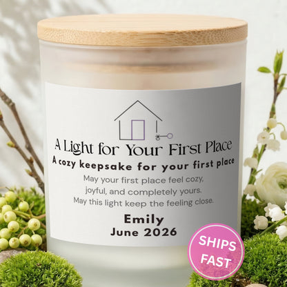 A Light for Your First Place personalized frosted candle with bamboo lid in a lifestyle scene with greenery