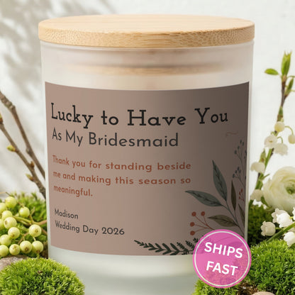 Lucky to Have You personalized frosted candle with bamboo lid in a lifestyle scene with greenery
