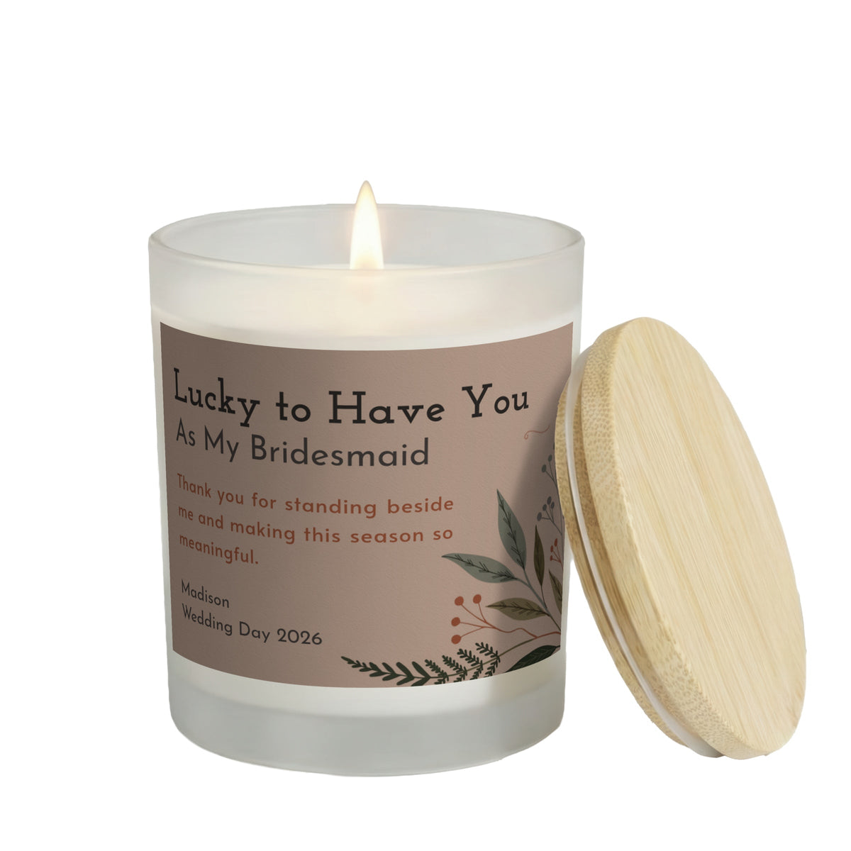 Lucky to Have You personalized frosted candle, lit with the bamboo lid set aside, on a white background