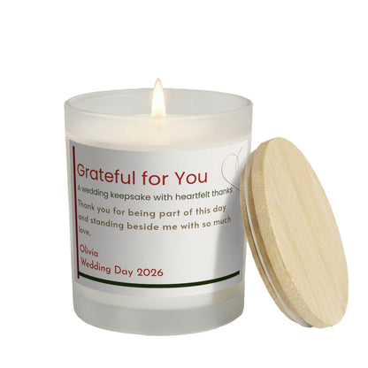 Grateful for You personalized frosted candle, lit with the bamboo lid set aside, on a white background
