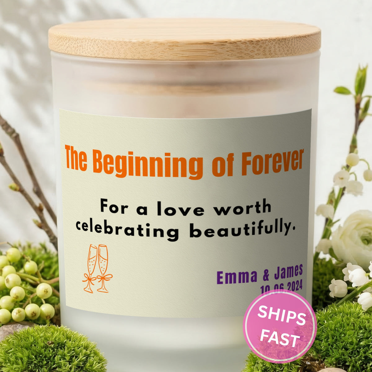 The Beginning of Forever personalized frosted candle with bamboo lid in a lifestyle scene with greenery