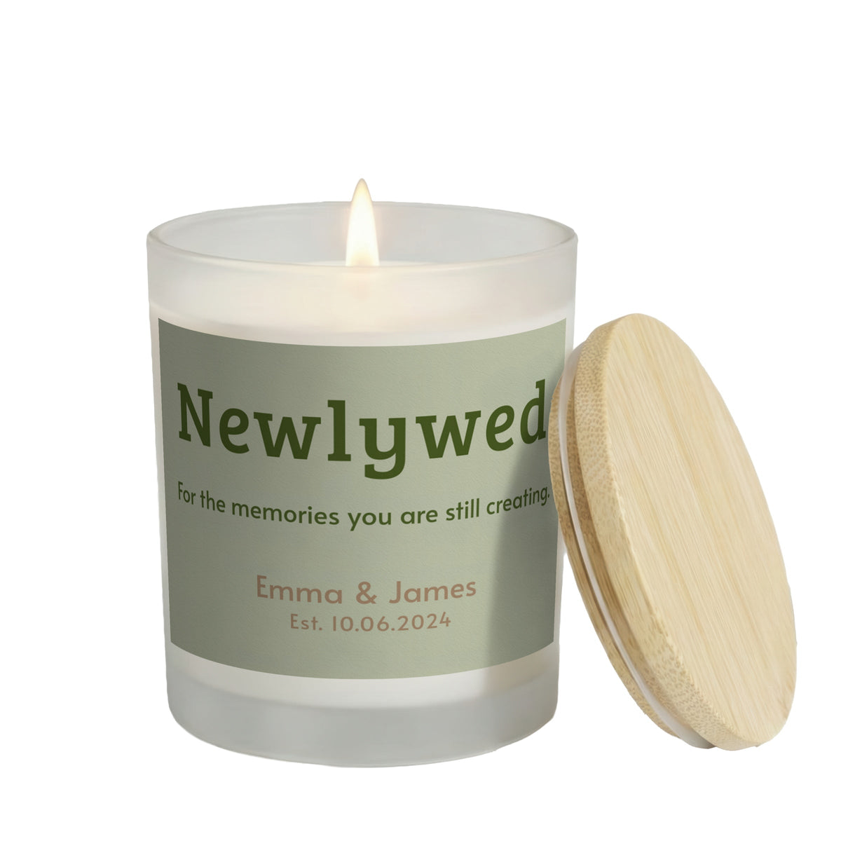 Memories You Are Still Creating personalized frosted candle, lit with the bamboo lid set aside, on a white background