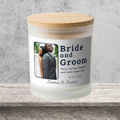 DESIGN F - Here's to Love and Laughter personalized frosted candle on a stone backdrop