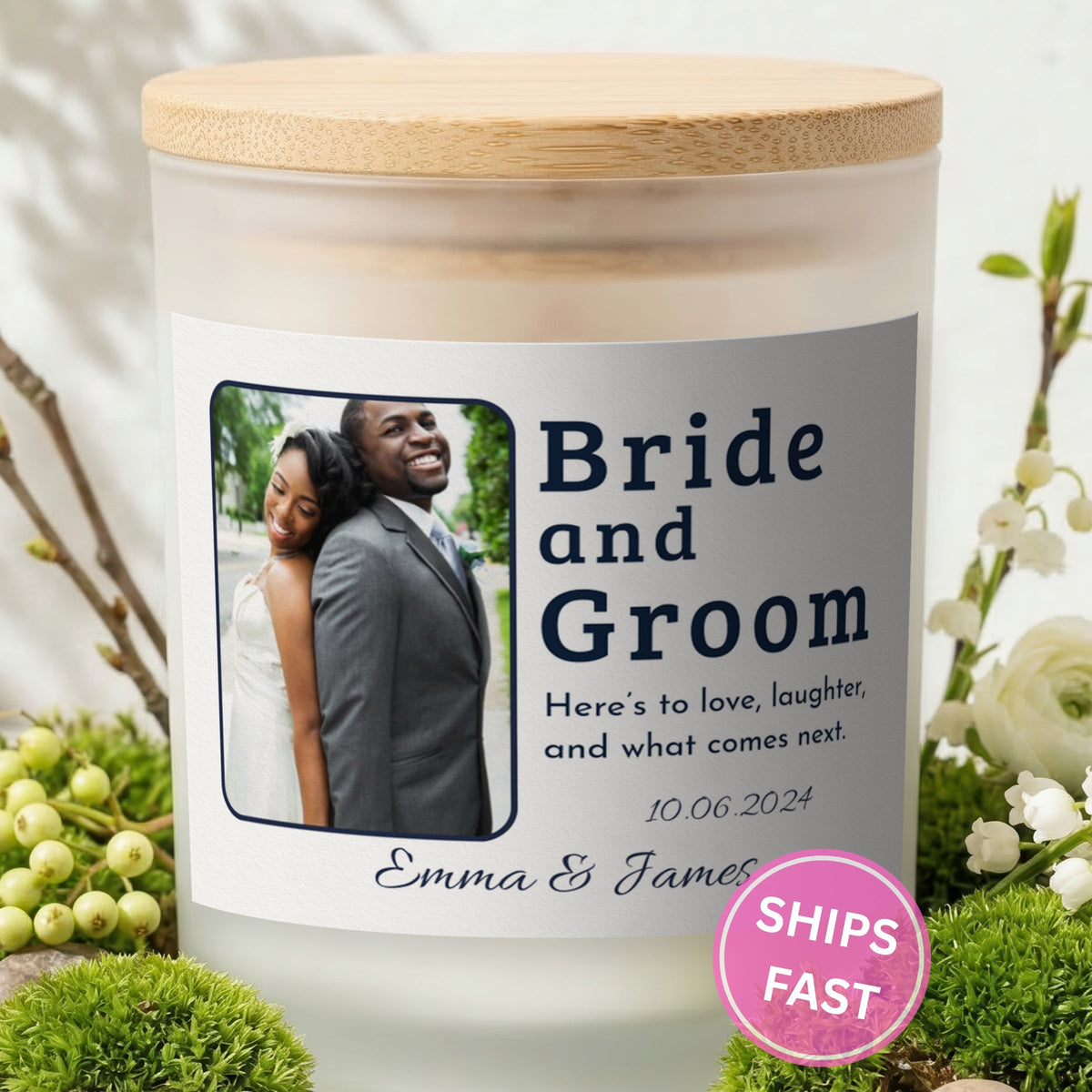 Here's to Love and Laughter personalized frosted candle with bamboo lid in a lifestyle scene with greenery