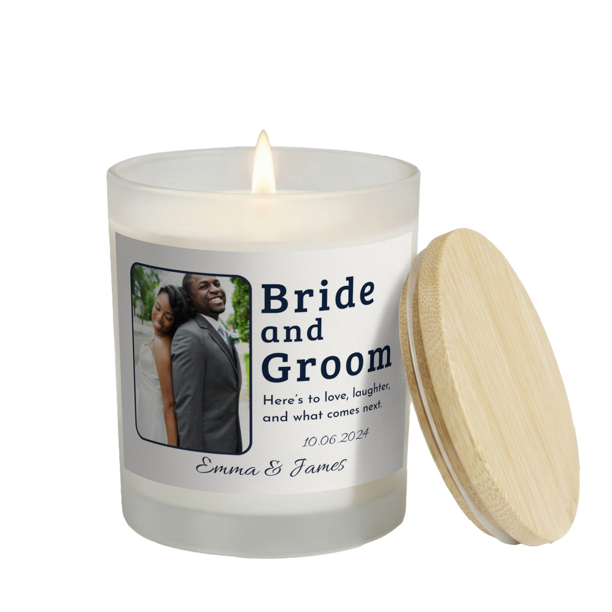 Here's to Love and Laughter personalized frosted candle, lit with the bamboo lid set aside, on a white background