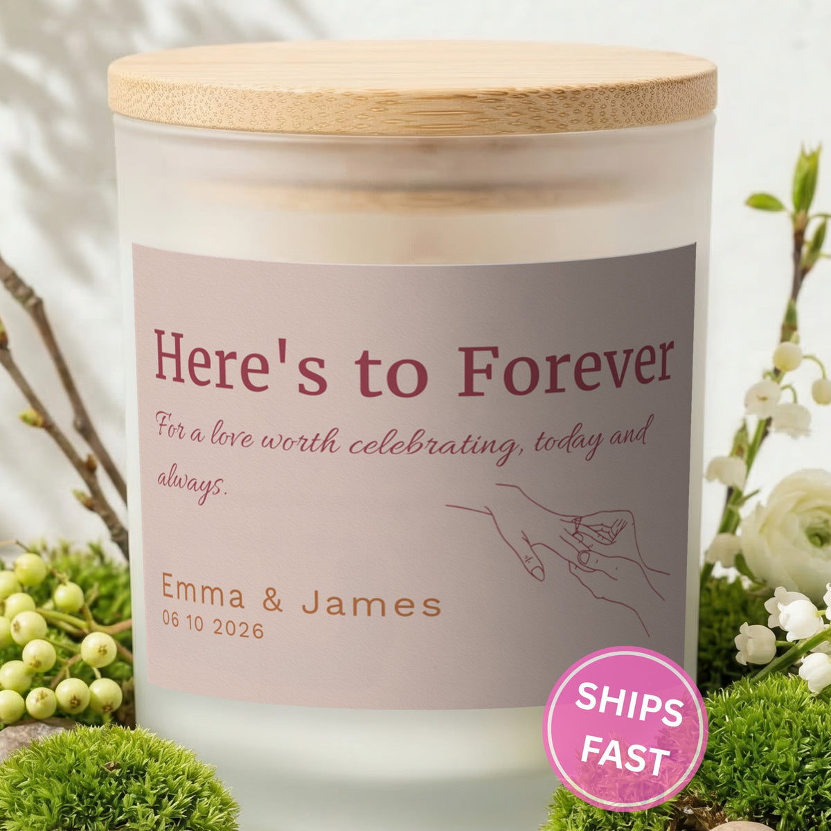 Here's to Forever personalized frosted candle with bamboo lid in a lifestyle scene with greenery